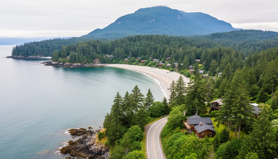 Scenic overlook of Bowen Island showing forested slopes rising toward Mount Gardner and a coastal road leading toward Snug Cove near the ferry.
